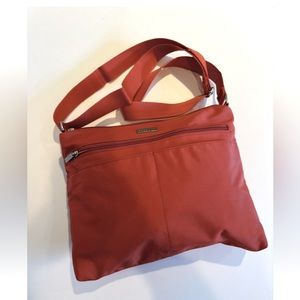 Baggallini Washable Voyage slip Pocket Hobo Bag In Orange